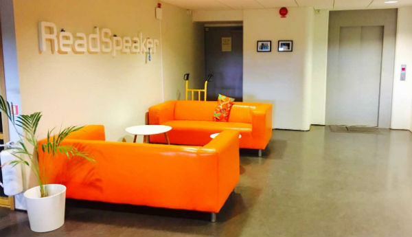 lounging area in ReadSpeaker office, orange couches