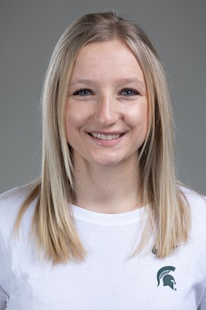headshot of a girl with long blonde hair wearing a MSU shirt