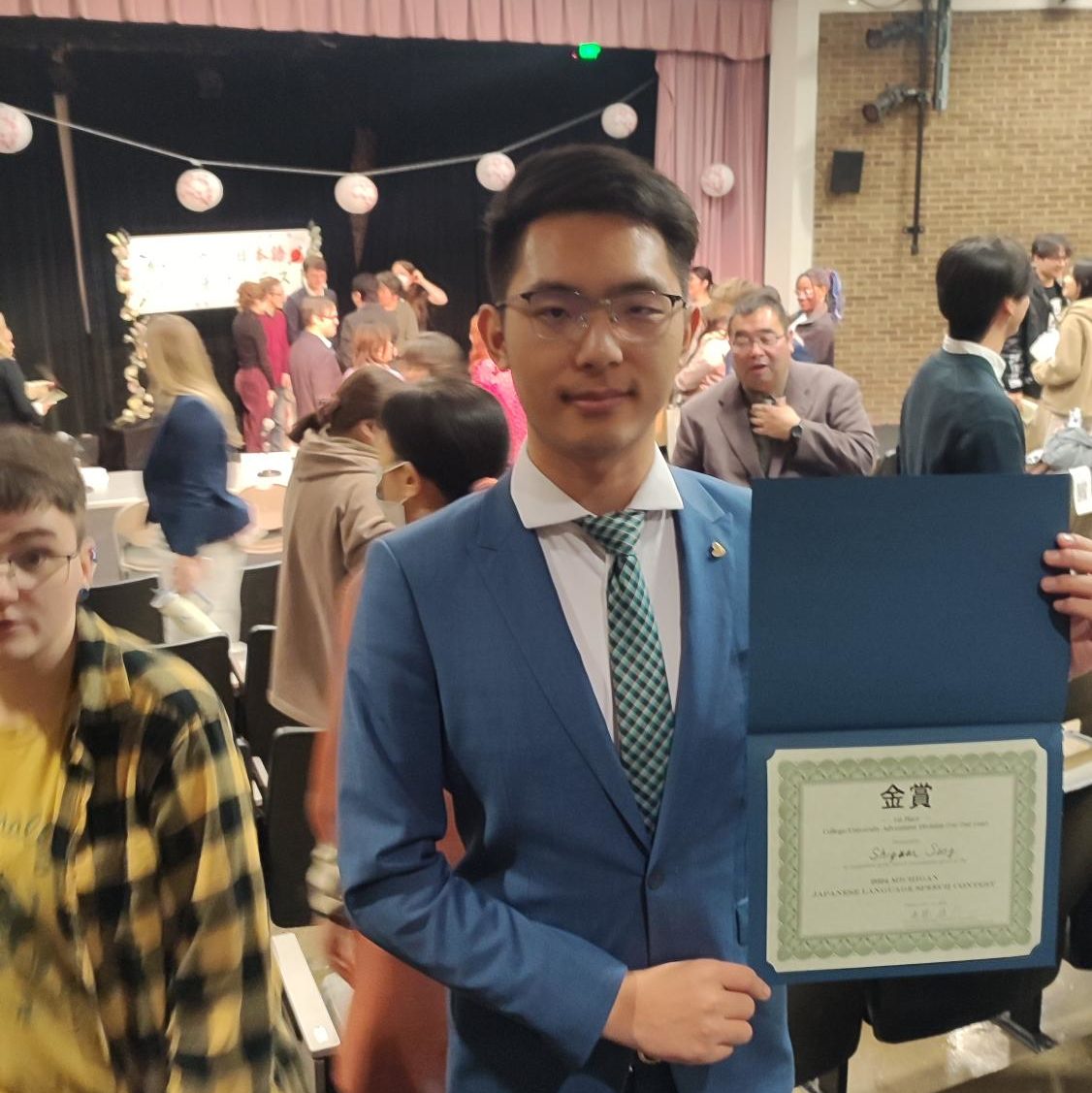 Shiyuan Song with his certificate